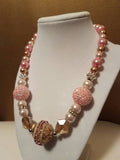 Pink and gold bead statement necklace with rhinestones and crystals