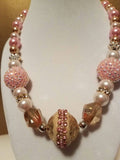 Pink and gold bead statement necklace with rhinestones and crystals