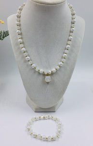 White and gold glass beaded necklace with matching bracelet set.