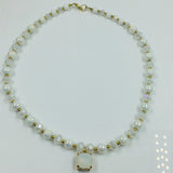 White and gold glass beaded necklace with matching bracelet set.