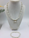 White and gold glass beaded necklace with matching bracelet set.