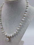 White and gold glass beaded necklace with matching bracelet set.