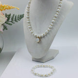 White and gold glass beaded necklace with matching bracelet set.
